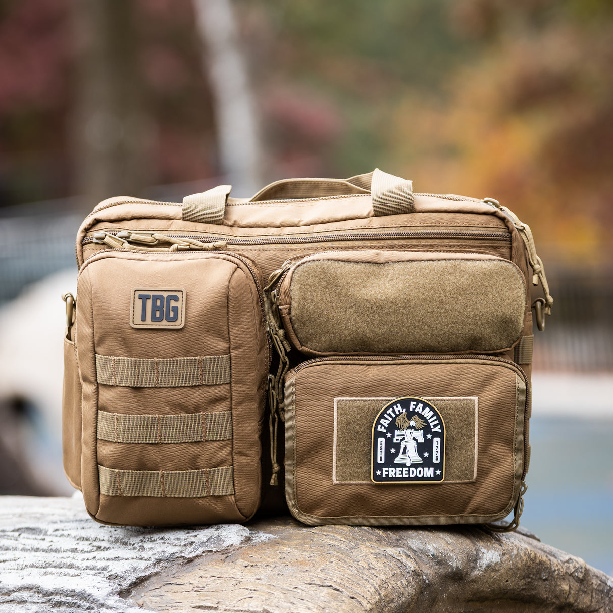 Rugged tactical bag featuring a Faith, Family, Freedom patch, designed for modern parents. Durable and functional.
