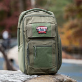 Rugged green backpack featuring the Lifting Buddy patch, designed for modern parents on the go.