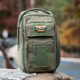 Tactical Baby Gear Future Hunting Buddy Patch on a rugged green backpack, designed for outdoor parenting adventures.