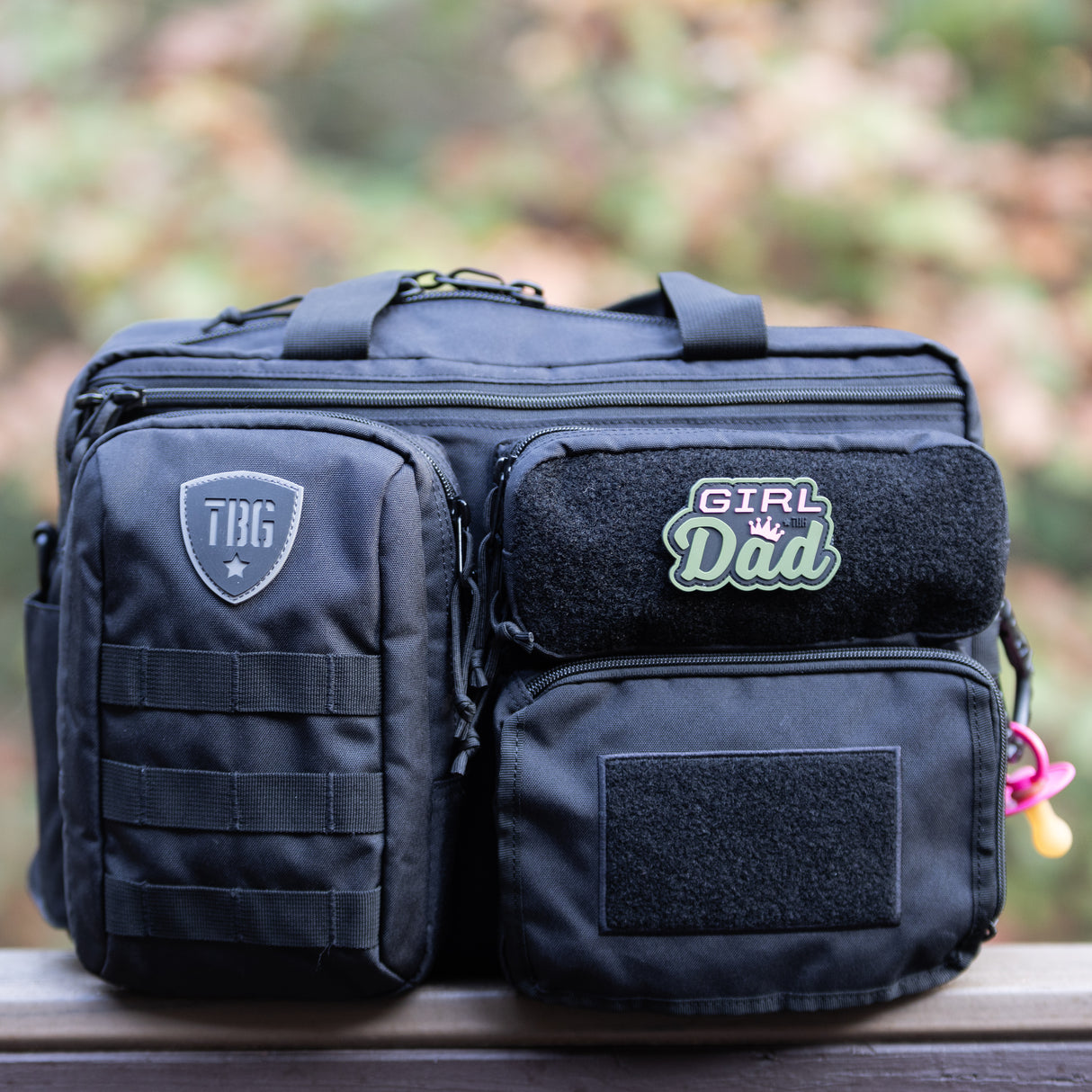 Tactical Baby Gear bag featuring a colorful "Girl Dad" patch, designed for rugged parenting needs.
