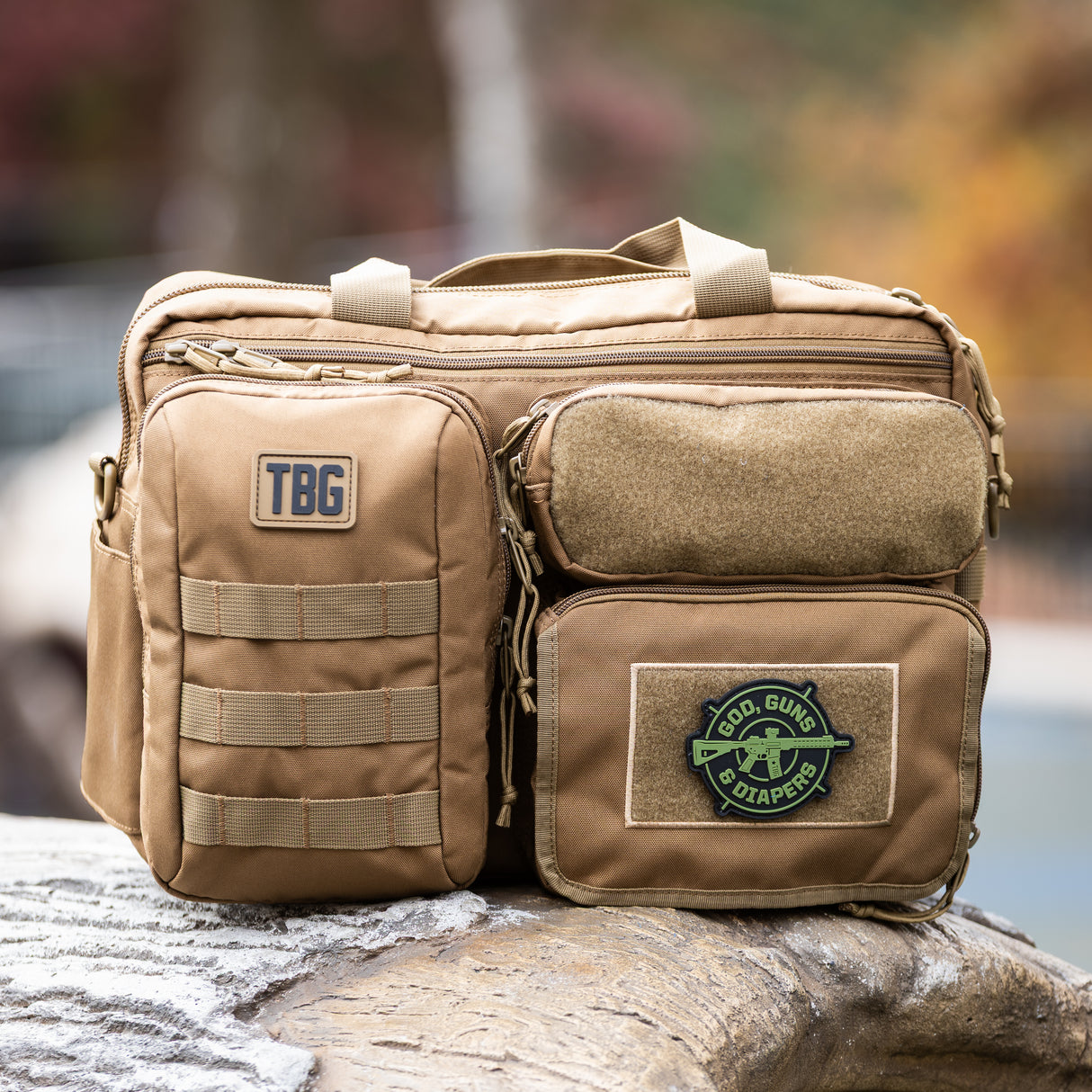 Tactical Baby Gear God, Guns & Diapers Crosshairs Patch on a rugged diaper bag with military-inspired design.