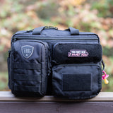 Tactical Baby Gear diaper bag featuring a "You hurt her, I hurt you" patch, designed for rugged parenting.