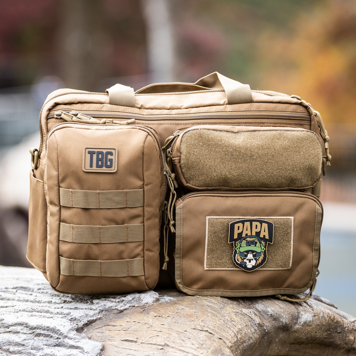Rugged tactical diaper bag featuring a Papa Bear patch, ideal for modern dads on the go. Durable and stylish design.