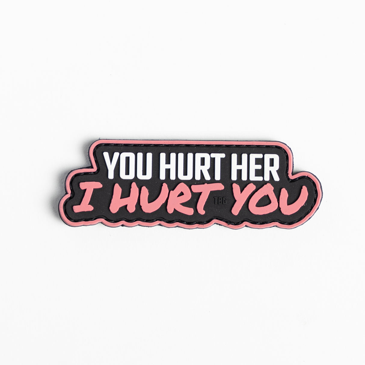 Embroidered patch with the text "You hurt her, I hurt you" in bold white letters on a black background.