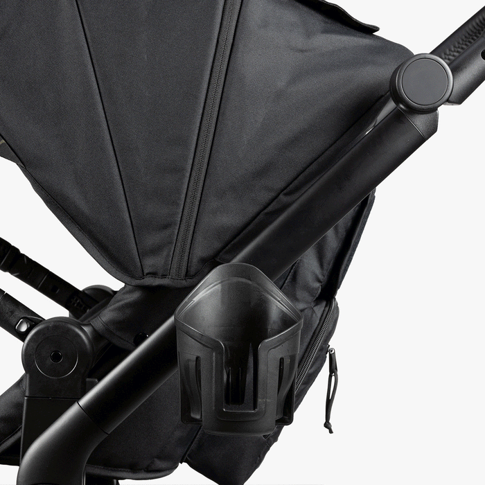 Black rugged stroller with a built-in cup holder, military-inspired design, and durable fabric for modern parents.