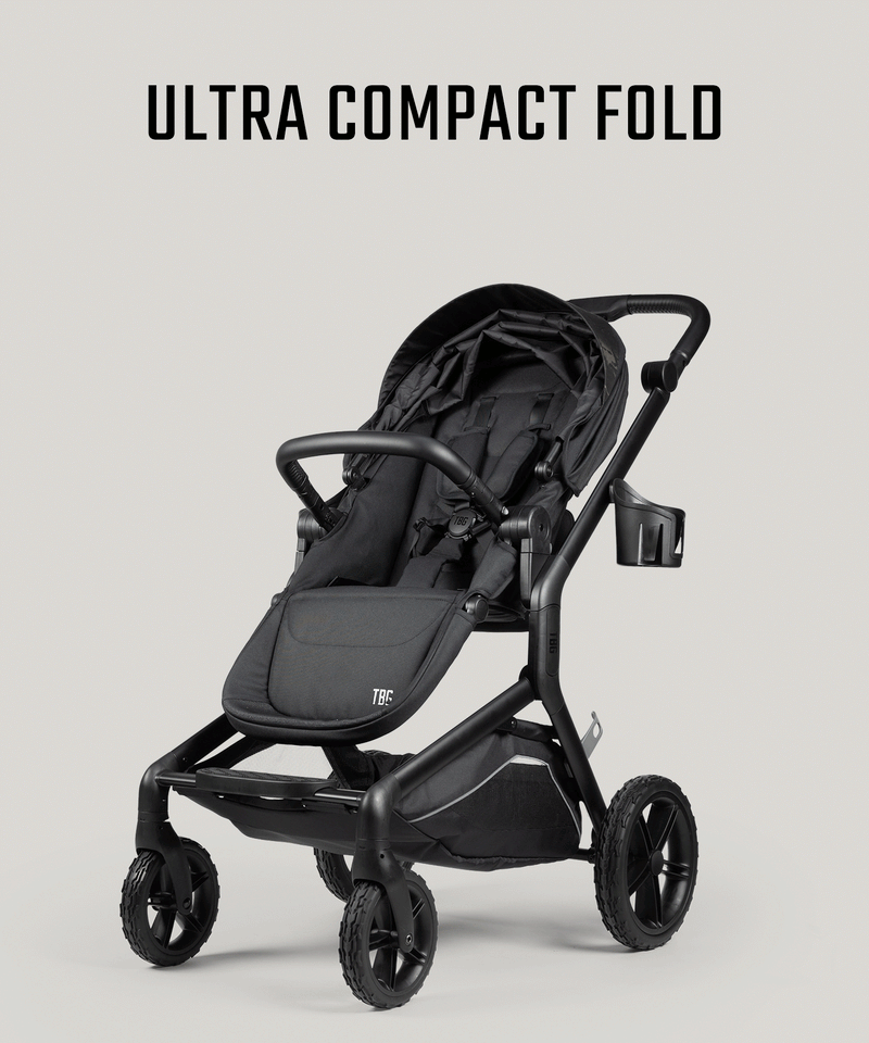 Black tactical baby stroller with durable tires and compact design, featuring sturdy frame and cup holder.