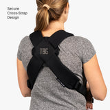 Mini diaper bag and baby carrier bundle featuring a secure cross-strap design for comfortable carrying.