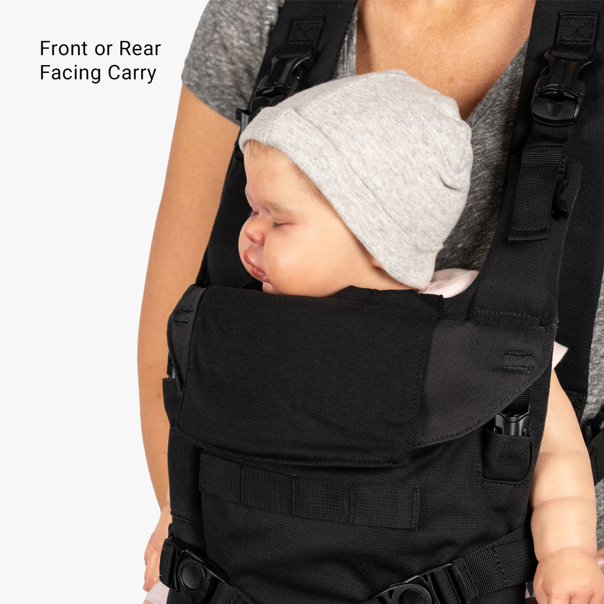 Mini diaper bag and baby carrier bundle featuring a baby comfortably seated in a front-facing position.