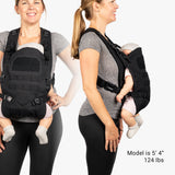 Mini diaper bag and baby carrier bundle shown on a model, demonstrating hands-free parenting with a sleek, rugged design.