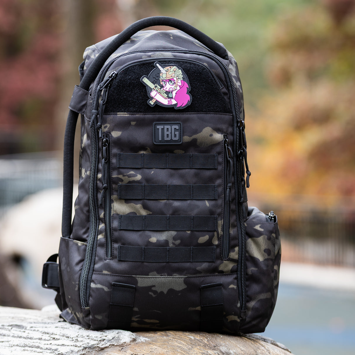 Tactical Unicorn Patch on a rugged black camo backpack, showcasing a playful yet tough design for parents.