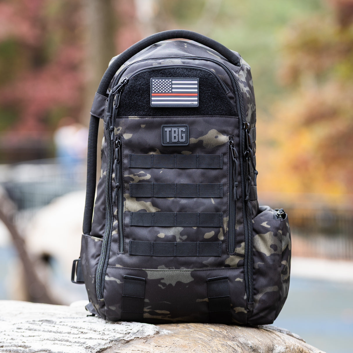 Thin Red Line USA flag patch on a rugged tactical backpack, showcasing military-inspired design for parents.