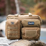 Tactical Baby Gear bag featuring a "Verified Dad" patch, designed for rugged parenting and outdoor adventures.