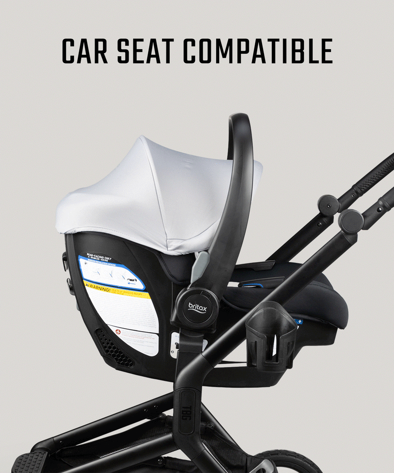 Black infant car seat with white canopy, mounted on a rugged stroller frame, emphasizing military-inspired parenting gear.
