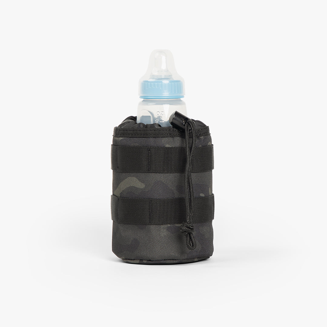 Rugged Tactical Bottle Pouch® in camouflage, designed to securely hold baby bottles for active parents.
