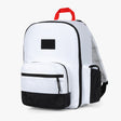 Alt text: Classic white and black diaper bag backpack featuring multiple compartments, a red carry handle, and external pockets, ideal for organized baby essentials storage.