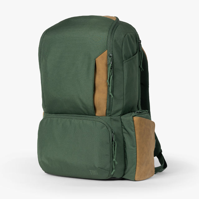 A rugged, Hunter green Expedition diaper bag with multiple pockets, adjustable straps, and a roll-top closure on a white background., Men's Diaper Bag