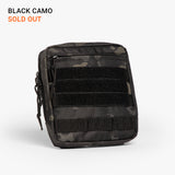 Black camouflage tactical diaper bag with multiple zippered compartments and MOLLE webbing for rugged parenting gear.