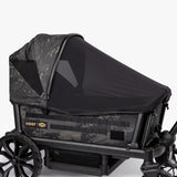 Rugged Cruiser Newborn Bundle featuring a camouflage stroller with a protective canopy and spacious storage.