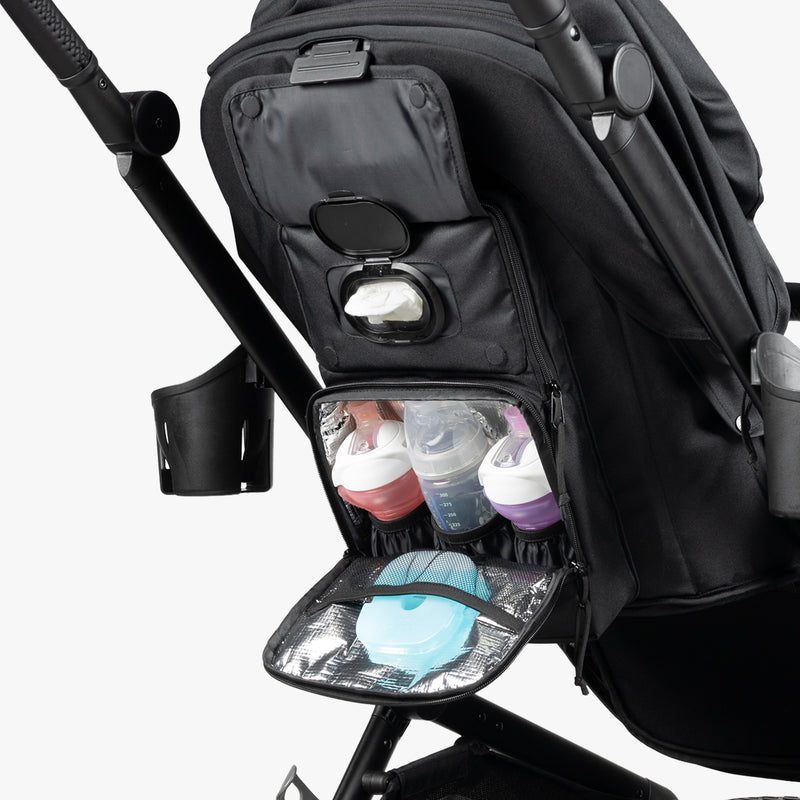Black stroller with insulated bottle pockets, tissue dispenser, and rugged military-inspired design for modern parents.