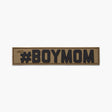 Brown nametape with black lettering reading #BOYMOM