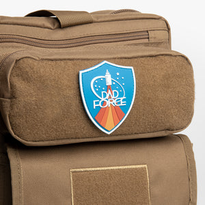 Dad Force patch on brown diaper bag backpack.