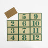 Tan patches with green numbers 1-12