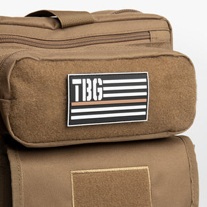 TBG Thin Brown Line patch on brown diaper bag backpack.