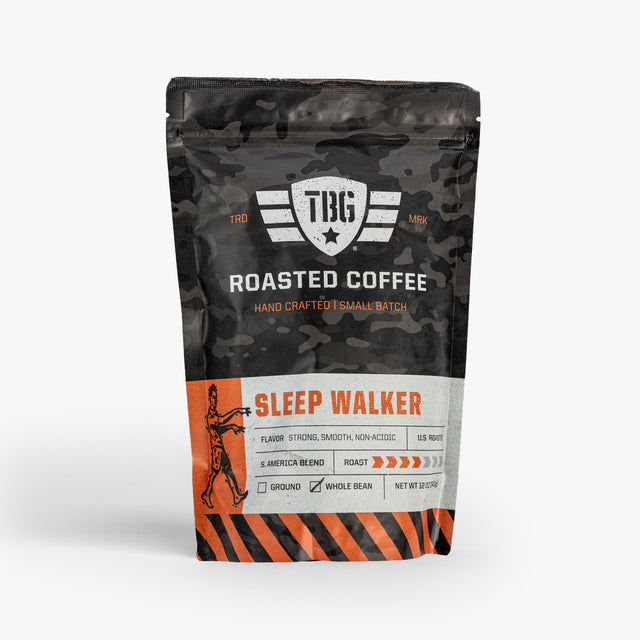 Rugged black coffee bag with orange and white military-inspired logo, labeled "Sleep Walker" roast, small batch, smooth, n...