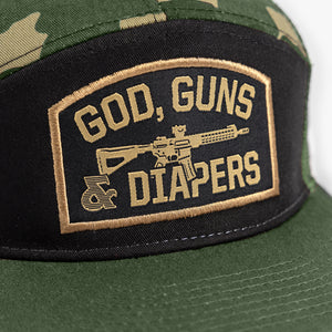 Close up of embroidery showing detail of God, Guns & Diapers design