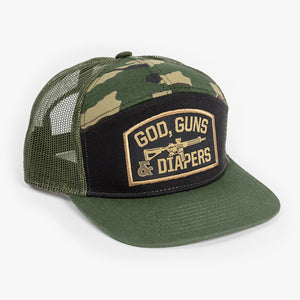Front of hat showing green bill, and gold God, Guns & Diapers embroidery on black background.