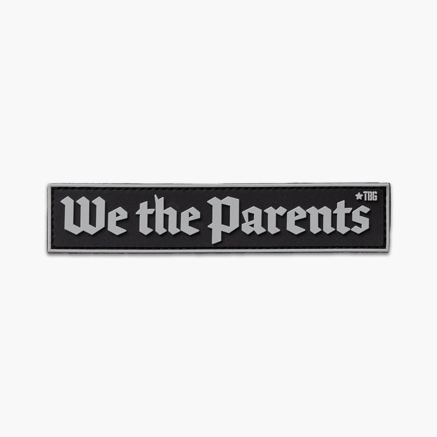 Black patch with gray lettering reading We the Parents in constitutional style script. 