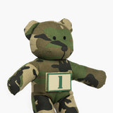 Camouflage teddy bear wearing tan patch with a green number 1 on it. 