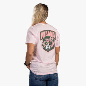 Rear view of woman wearing soft pink t-shirt with bear face and mama written above it. 